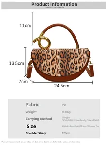 Detail of leopard print handbag with golden twisted handle and brown leather strap