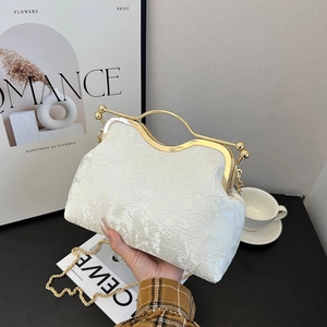 Elegant white satin shell bag with floral embroidery and golden metal handle