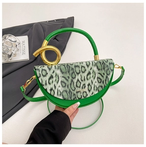 Detail of green semi-circle bag with leopard print flap and golden metal ring handle