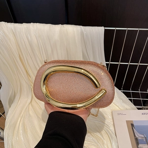 Pink rhinestone encrusted oval evening clutch bag with gold C-handle and chain strap