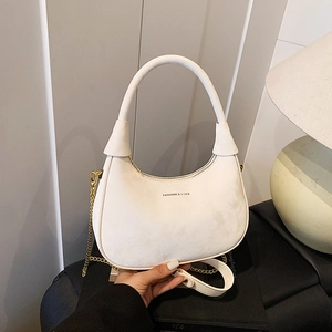 Elegant white velvet hobo shoulder bag with a gold chain strap and moon-shaped design