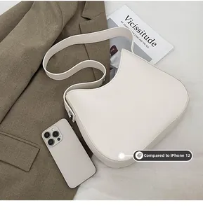 Off-white hobo bag size comparison with an iPhone on a neutral background