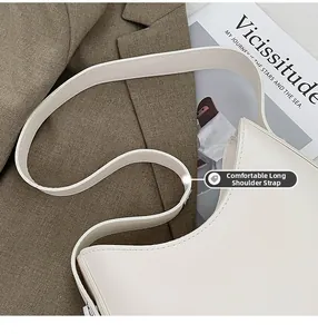 Close-up of a cream crossbody bag showing the comfortable long shoulder strap detail