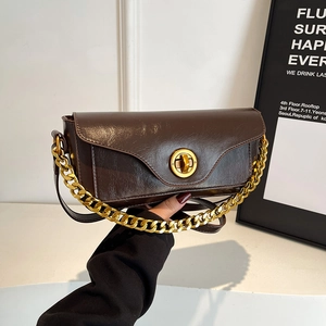 Retro dark brown oily leather shoulder bag with gold clasp and chunky chain detail