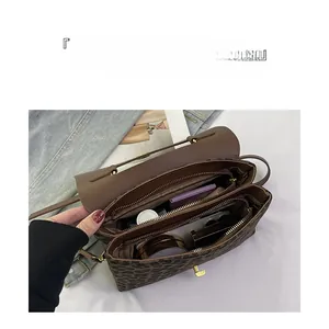 Detailed internal compartments of leopard print bag showing ample storage space