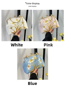 Detail of floral embroidery on vintage handbags in white, pink and blue colors