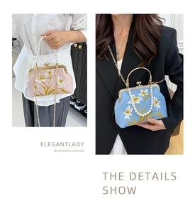 Detail of vintage floral embroidery and elegant pearl handle on a retro frame clutch bag