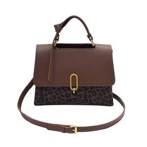 Brown leather and leopard print handbag with golden U-shaped lock and crossbody strap