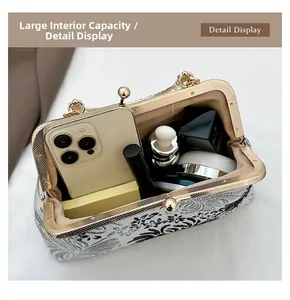 Detail display of vintage jacquard fabric bag showing spacious interior and golden clasp