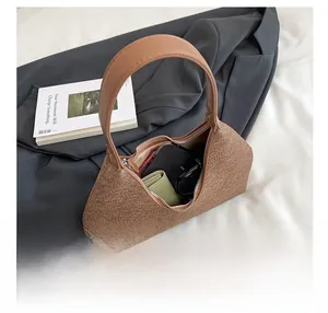Interior view of brown glitter handbag showing storage for phone and accessories