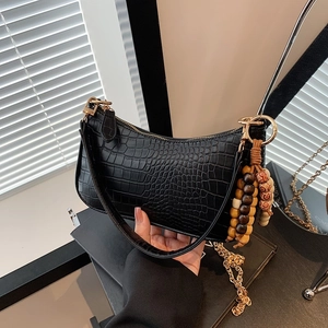 Black faux leather baguette bag with crocodile texture and vintage beaded charm pendant