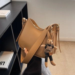 Minimalist camel PU leather hobo bucket bag with cute rabbit pendant for women