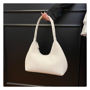 Close-up of the white hobo bag showing the high-quality textured faux leather and zipper