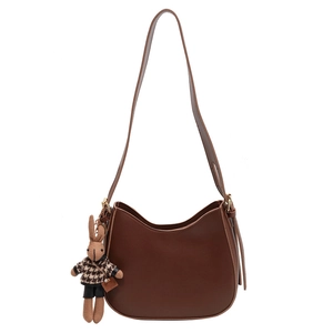 Dark brown crescent bucket bag with a cute rabbit pendant accessory for women