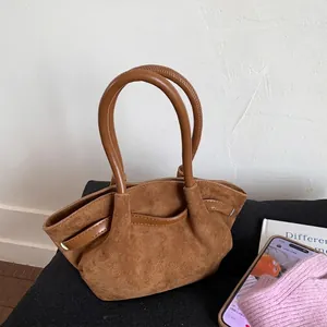Brown suede basket handbag with pleated design and smooth leather trim for daily commute