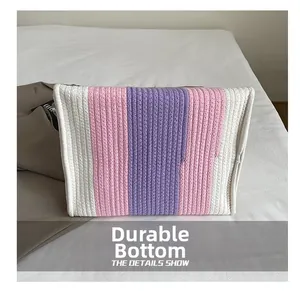 Close-up of rainbow striped cotton rope weave and durable texture on a handbag
