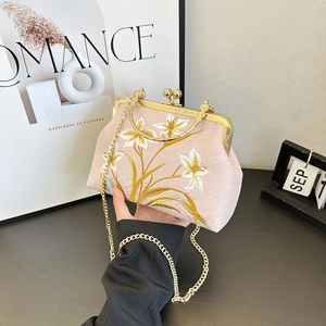 Vintage light pink satin handbag with floral embroidery and golden chain strap
