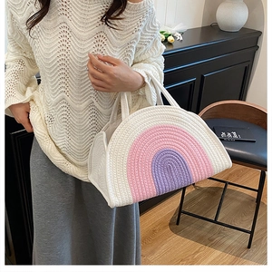 Detail of rainbow striped cotton rope woven bag showing texture and circular handle