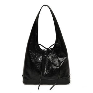 Glossy black tote bag with bow detail and crinkled leather finish for women