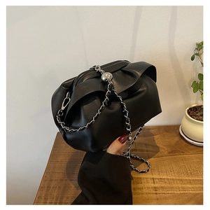 Chic black pleated cloud shoulder bag with silver chain strap and metallic ball detail