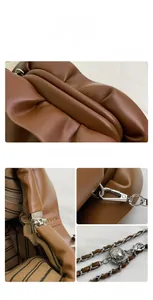 Detail of brown leather cloud bag featuring silver chain strap and striped lining