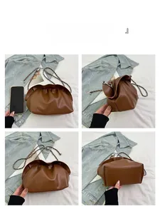 Detailed views of a brown cloud bag with silver metal chain strap from multiple angles