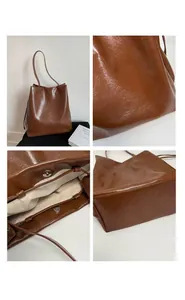 Detail view of brown glossy leather tote bag featuring magnetic buckle and thickened base
