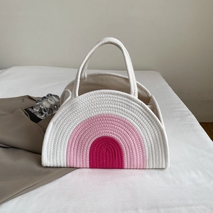 Chic cotton rope woven tote bag featuring a colorful gradient rainbow pattern for beach vacations