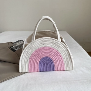 Rainbow striped cotton rope woven handbag with a semi-circular design for beach vacations