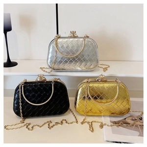Detail of evening clutch bags with metallic lattice texture and rhinestone buckle locks