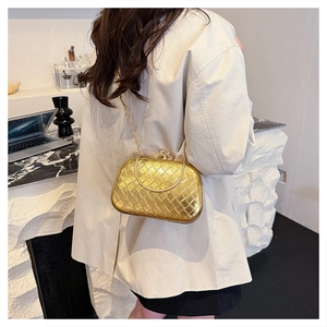 Golden woven texture clutch bag featuring metallic handle and elegant chain strap detail