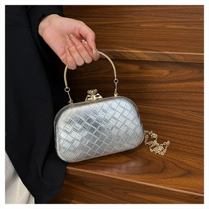 Silver woven evening bag with gold ring handle and sparkling rhinestone clasp detail