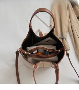 Top view of canvas bucket bag interior showing large capacity and internal pouch