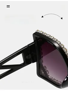 Macro shot of durable metal hinges on oversized square rhinestone sunglasses