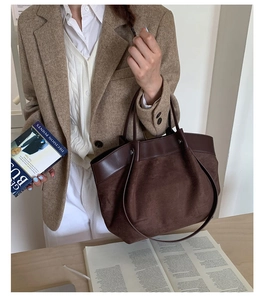 Detailed view of large capacity dark coffee tote bag in matte suede and leather trim