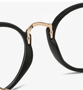 Detail of comfortable ergonomic gold nose pads on matte black fashion glasses frames