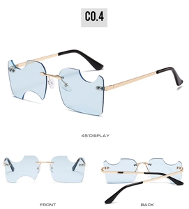 Lunettes de soleil bleues sans monture avec bords dentelés et branches en métal doré
