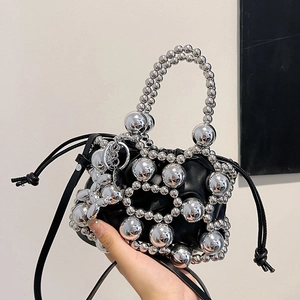 Fashionable black drawstring bucket bag with silver metal bead mesh and crossbody strap