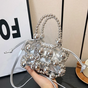 Silver metallic beaded mini handbag with top handle and crossbody chain for women