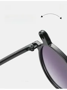 Close-up of durable metal hinge on kids sunglasses with black frames and purple lenses