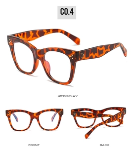 Detail view of square tortoiseshell blue light blocking glasses with gold rivet accents