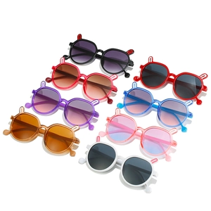 Colorful kids cartoon rabbit ear sunglasses in multiple vibrant shades on white background
