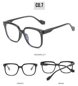 Detail view of square black kids sunglasses with silver rivets and blue light lenses