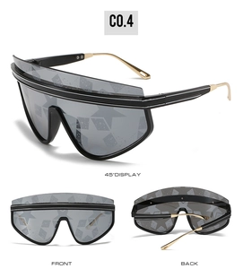 Detail view showing 45-degree angle, front and back of oversized star pattern sunglasses