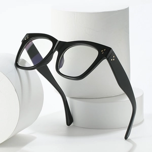 Chic black square blue light blocking glasses with golden triple stud accents on white stand
