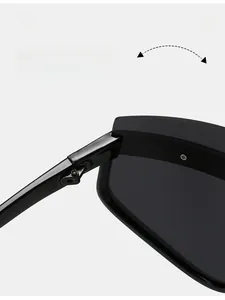 Close-up detail of durable metal hinge on black oversized fashion sunglasses