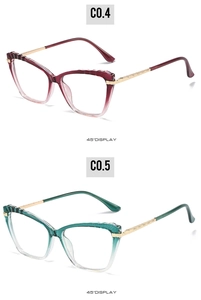 Detail view of TR90 cat-eye eyewear frames in red and green gradient with gold metal temples