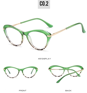 Detail of green cat-eye optical glasses frame with leopard pattern and gold metal temples