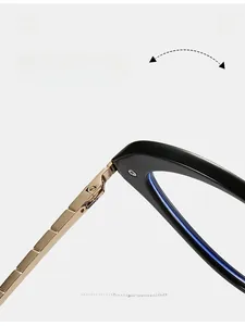 Detailed macro view of durable gold metal hinges on black cat-eye optical frames