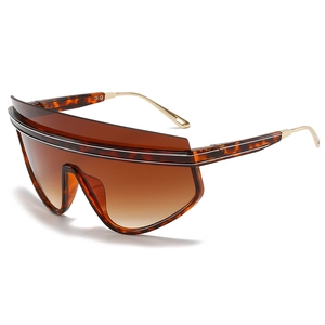 Oversized tortoise shell shield sunglasses with brown gradient lenses and gold metal arms